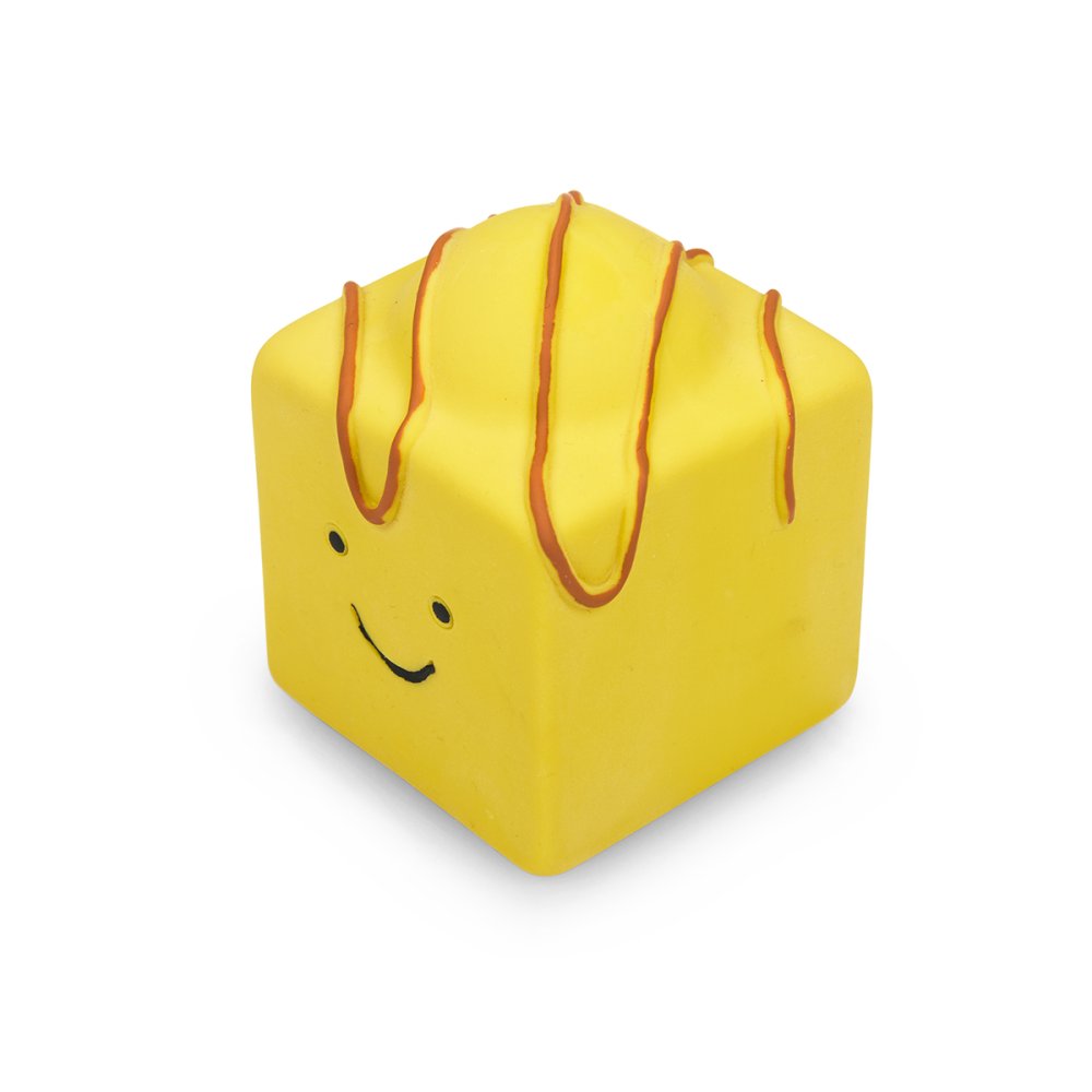 Yellow cube-shaped toy with a smiley face on a white background