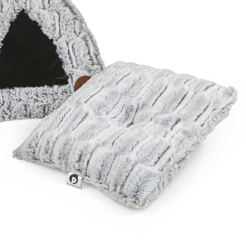 Fluffy gray pet bed with a matching pillow on a white background