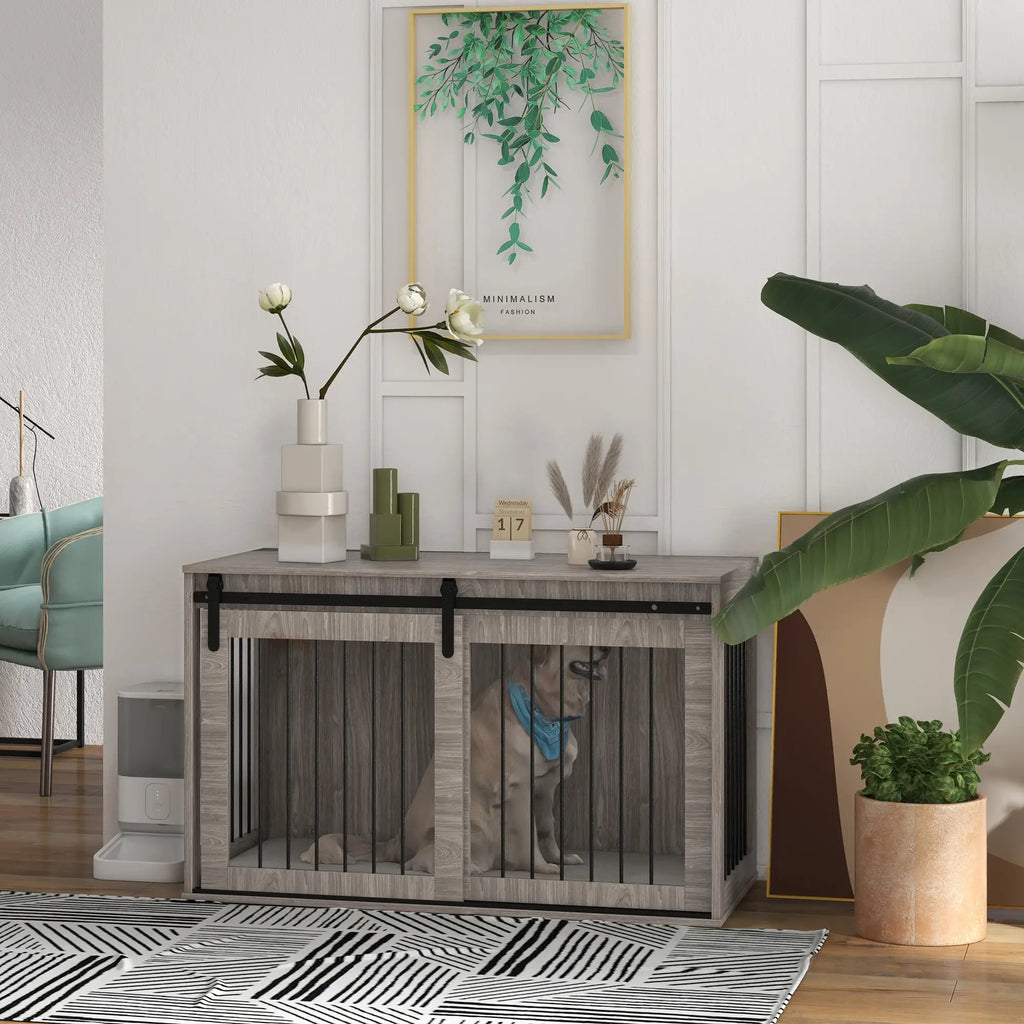 Modern interior with a wooden pet crate, decorative plants, and a framed picture on the wall.
