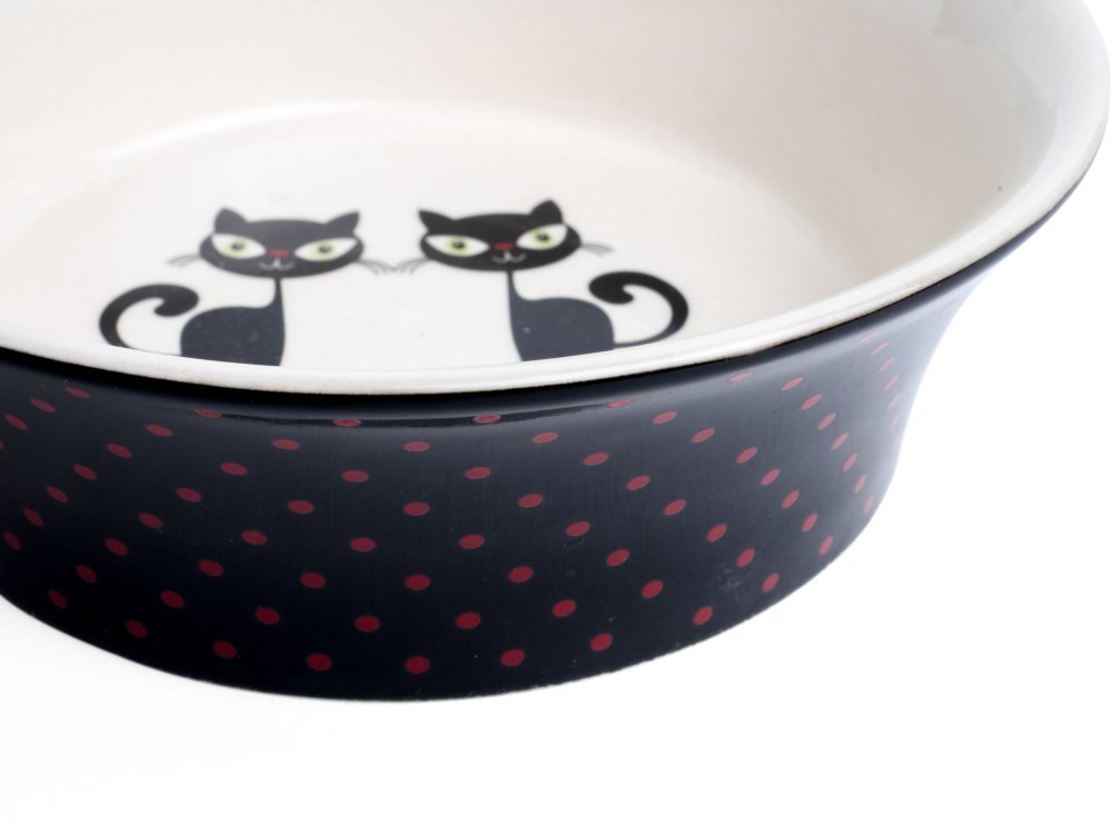 Cat-shaped bowl with polka dot pattern on a white background