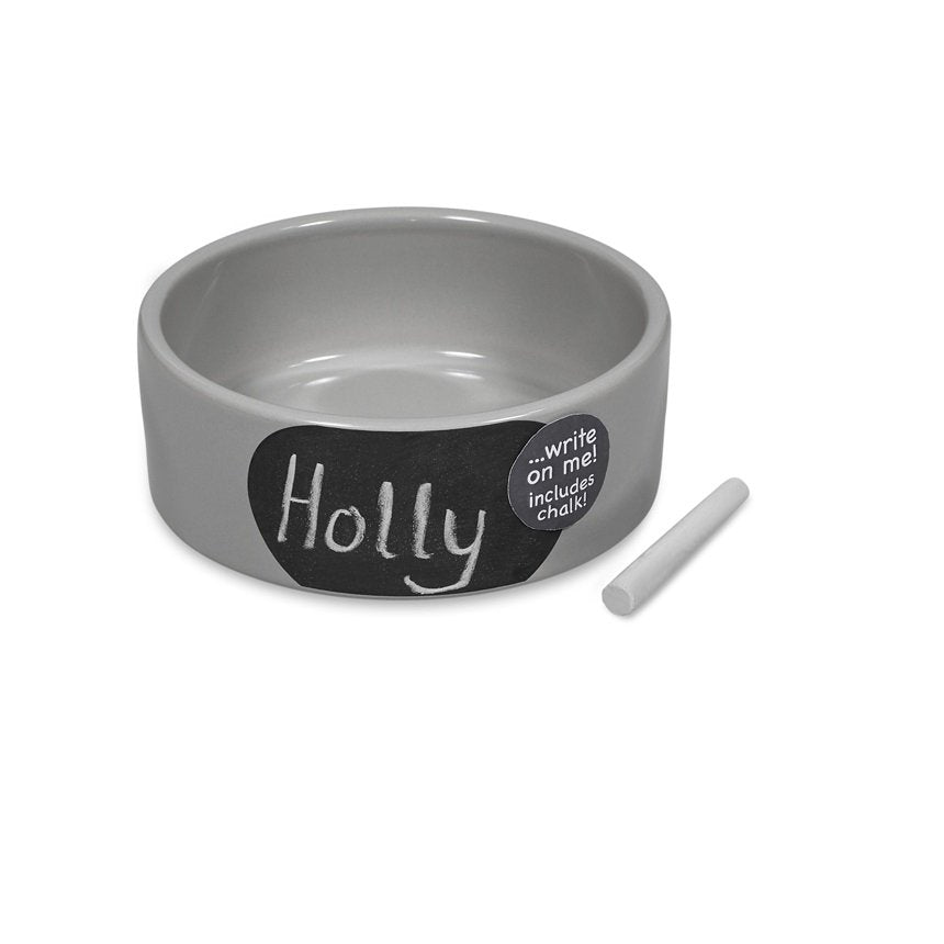 Gray pet bowl with 'Holly' label and chalk stick on a white background