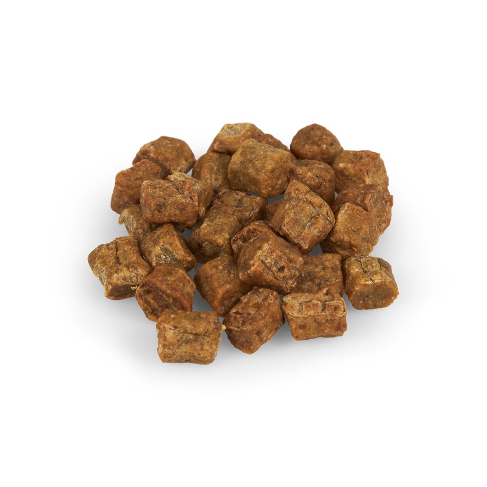 Brown dog treats on a white background