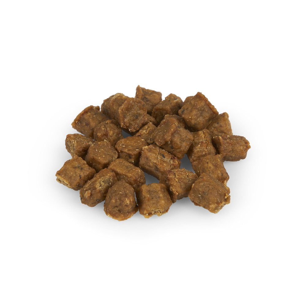 Brown pet food pellets on a white background