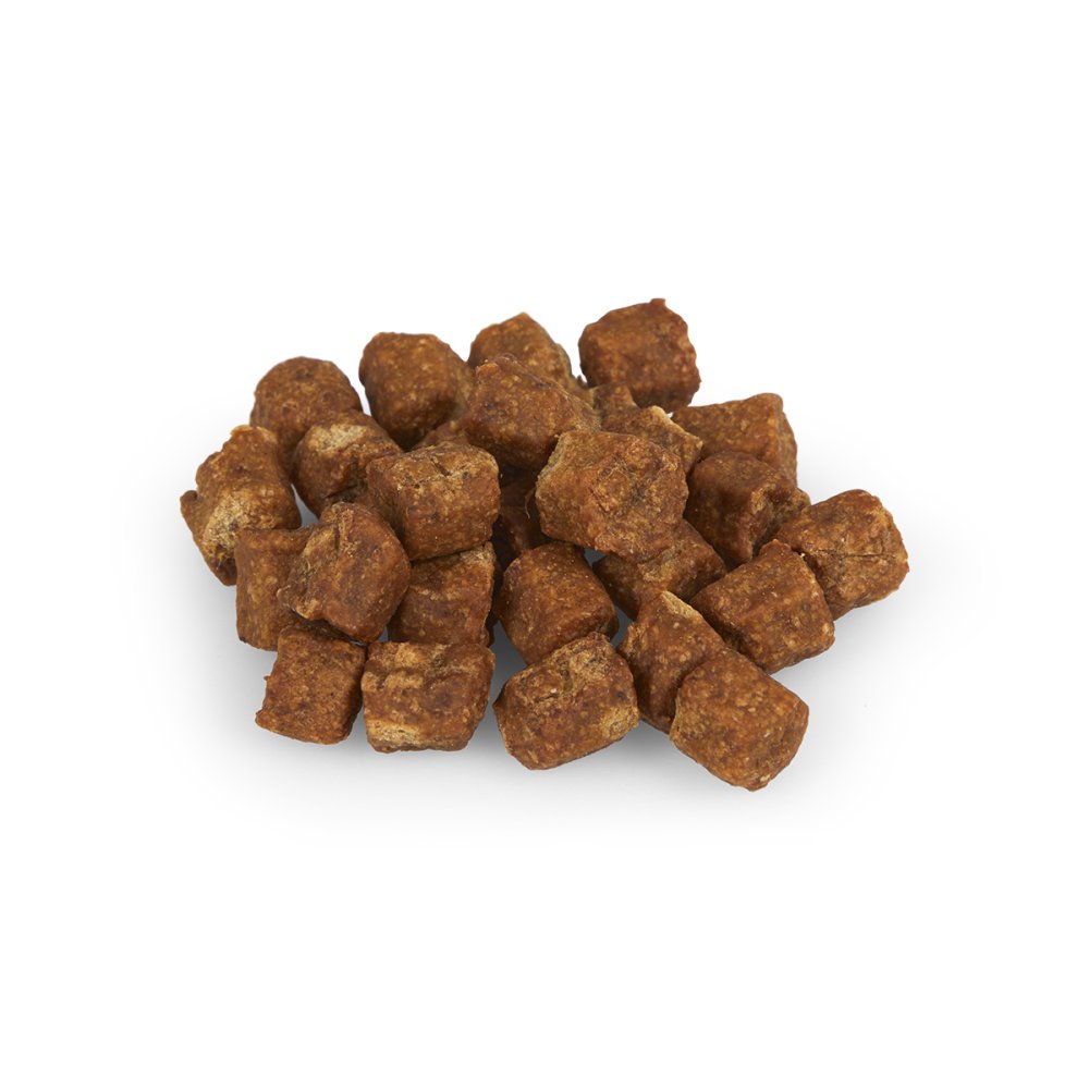 Brown dog treats on a white background