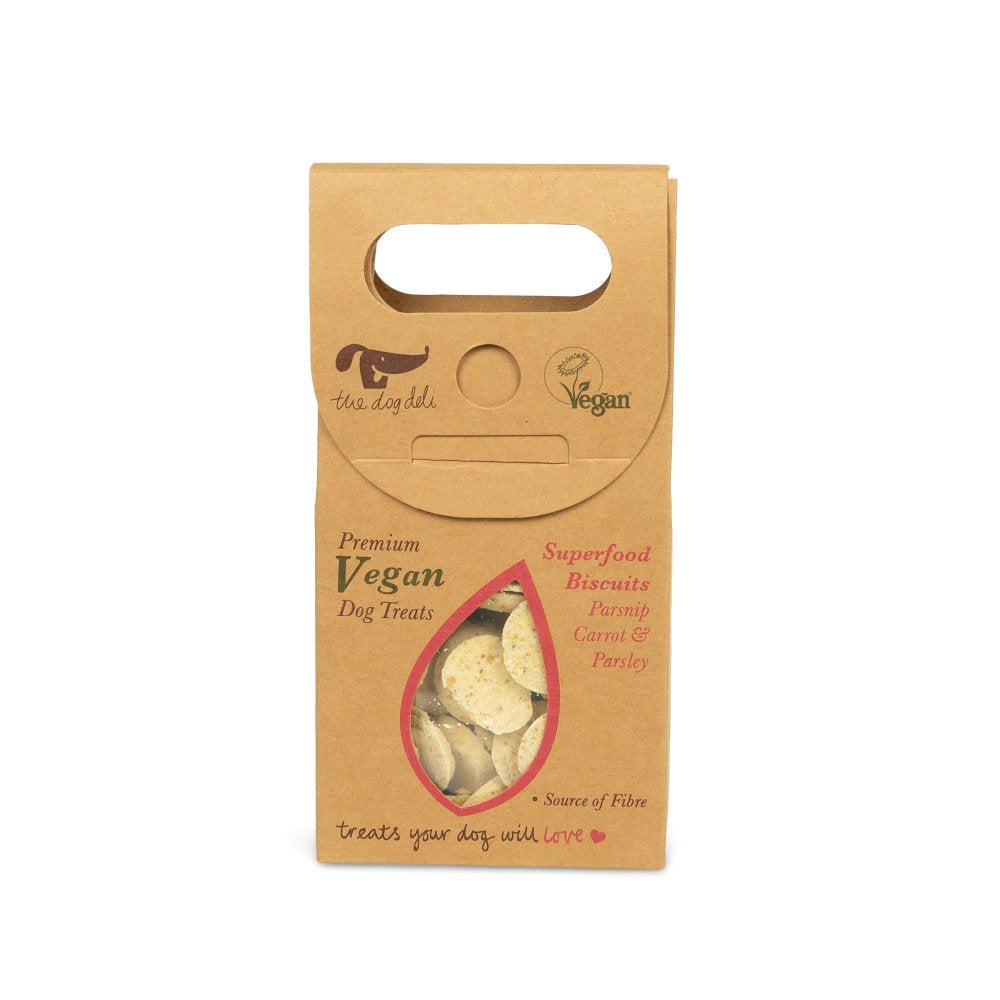 Kraft paper packaging of vegan dog treats with visible treats inside on a white background