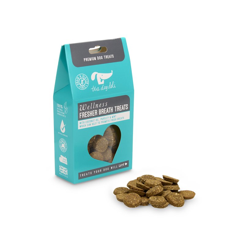 Teal package of dog treats with heart-shaped hole  on a white background