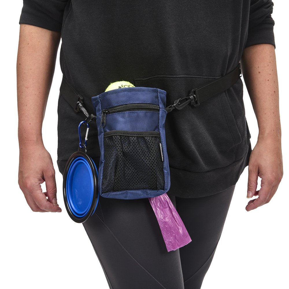 Person wearing a black outfit with a blue waist bag containing a blue bowl and pink bag on a white background