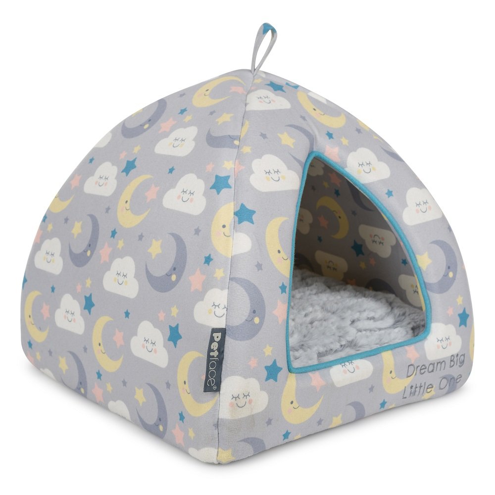 Cat bed with cloud, moon, and star pattern on a white background