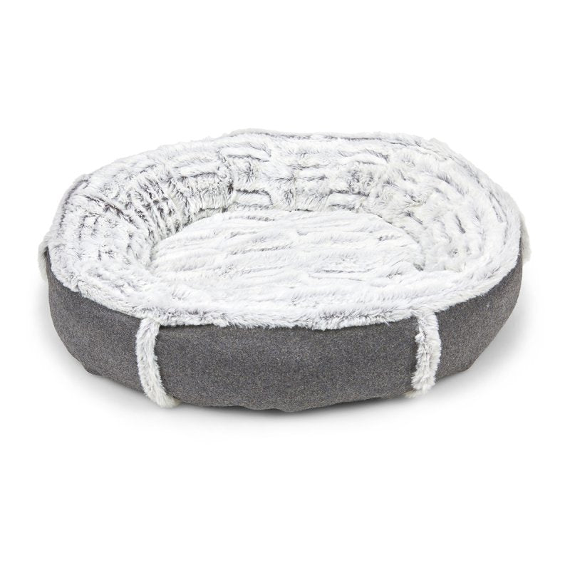 Round pet bed with gray exterior and white interior on a white background