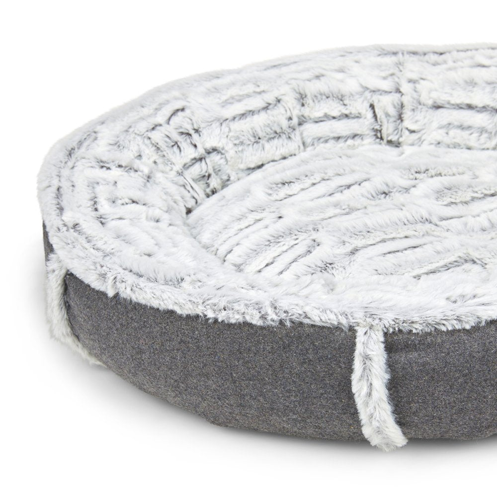 Round pet bed with textured gray and white design on a white background