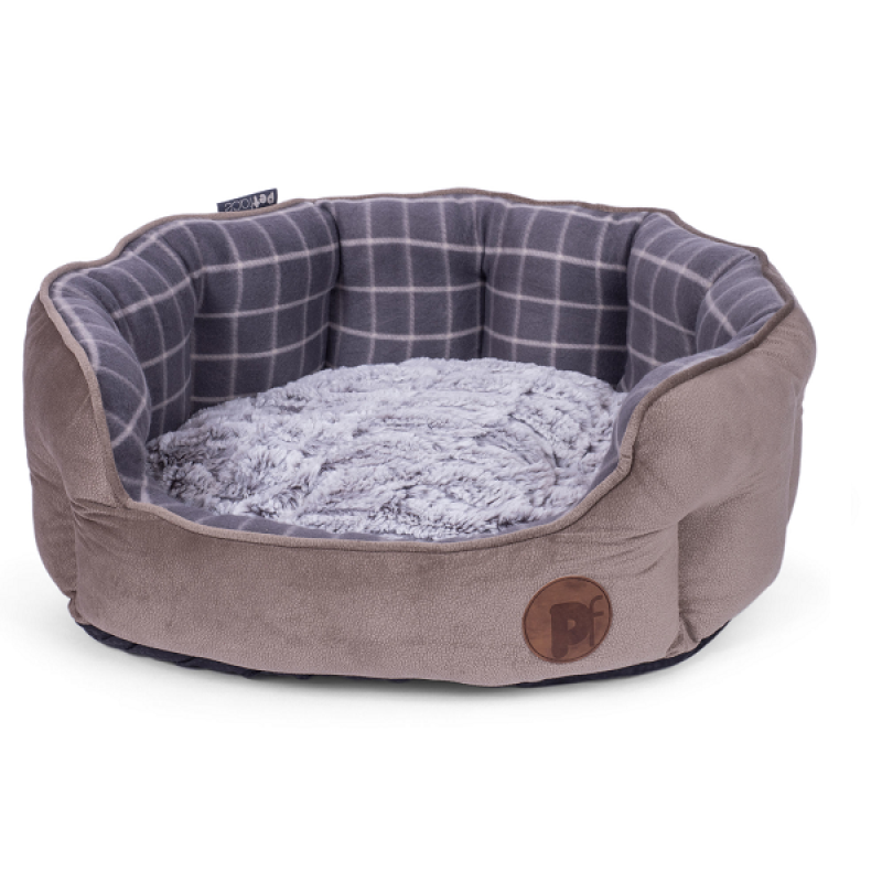 Dog bed with plaid interior and beige exterior on a white background