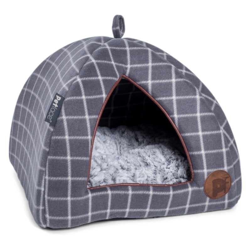 Plaid patterned pet bed with fluffy interior on a white background