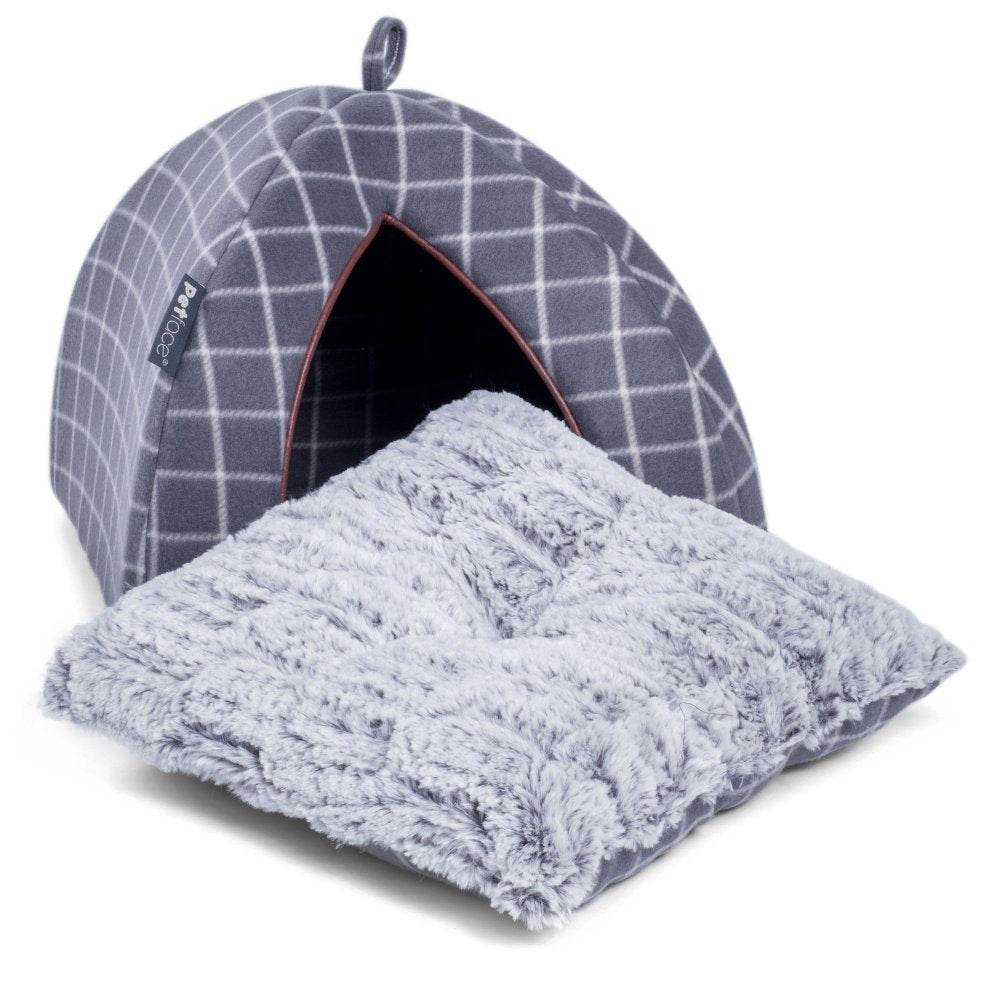 Gray checkered pet bed with a fluffy gray blanket on a white background