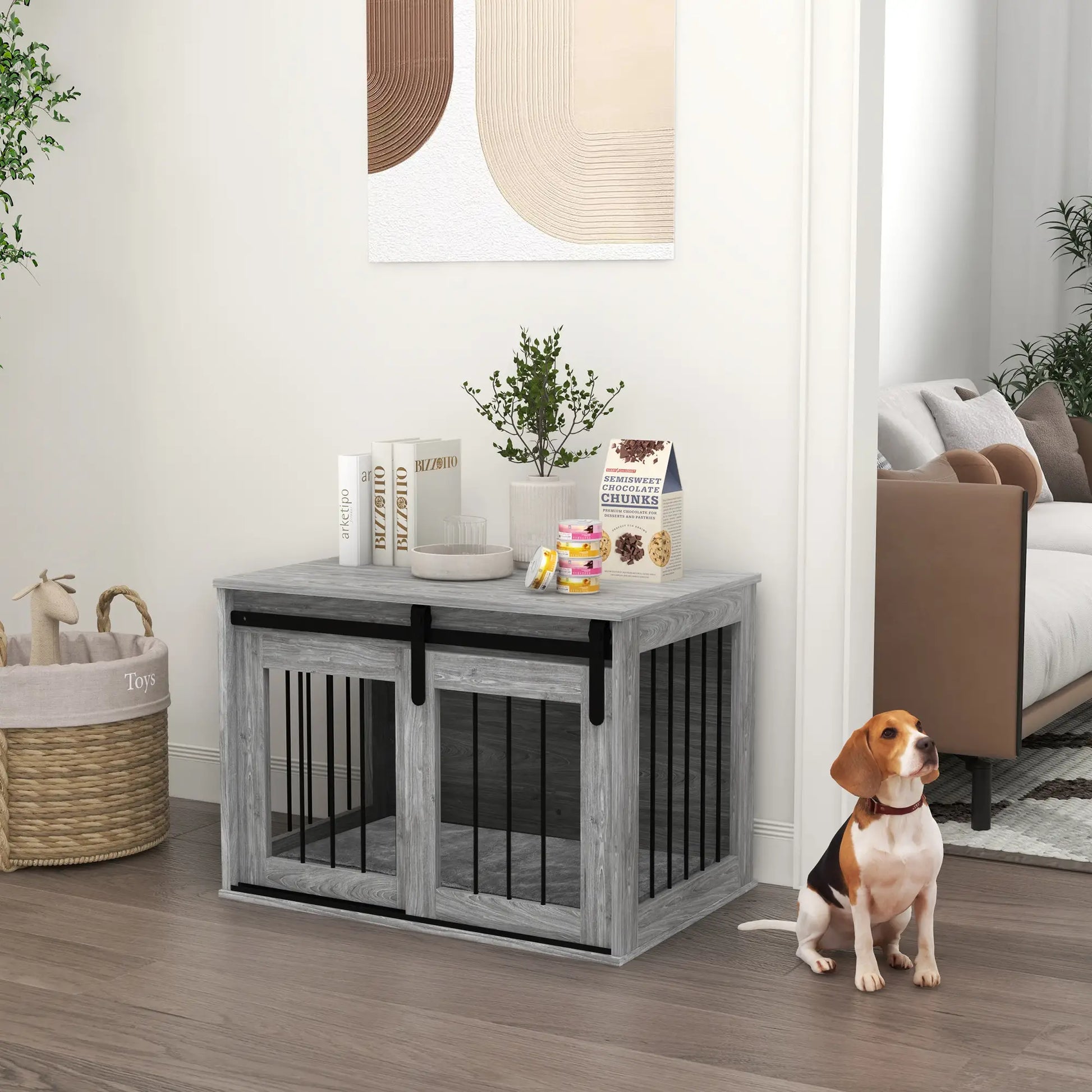 Dog crate in a living room with a dog sitting next to it