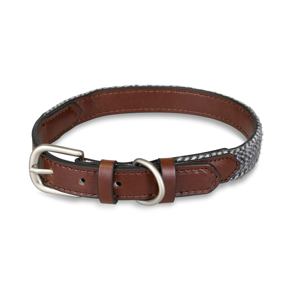 Dog collar with brown leather and patterned fabric strap on a white background