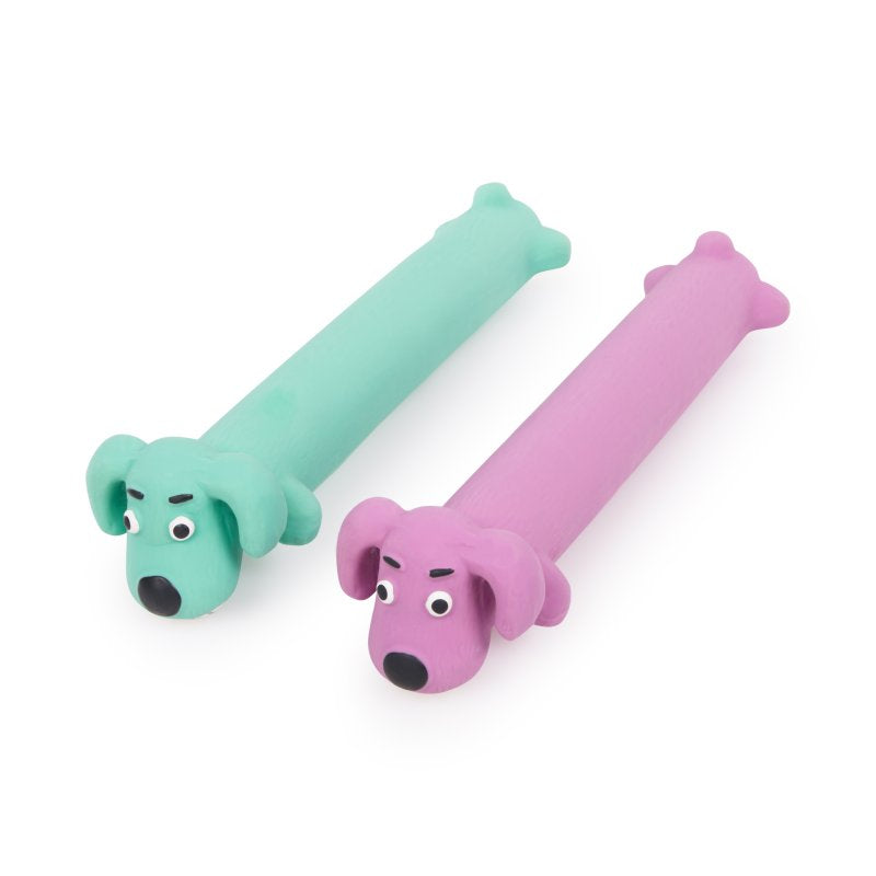 Two green and pink dog-shaped Loofah Dog Toys on a white background