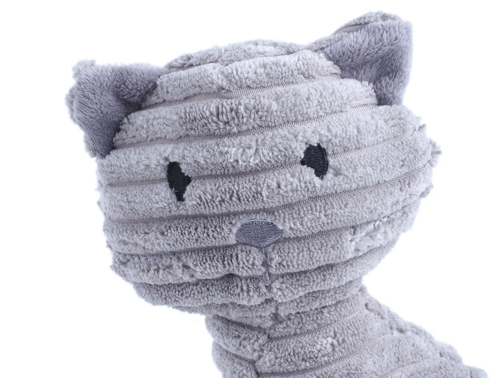 Gray plush dog toy with a white background