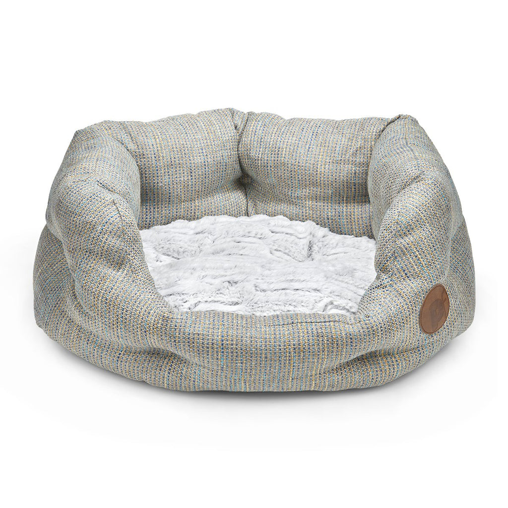 Gray pet bed with a textured surface on a white background