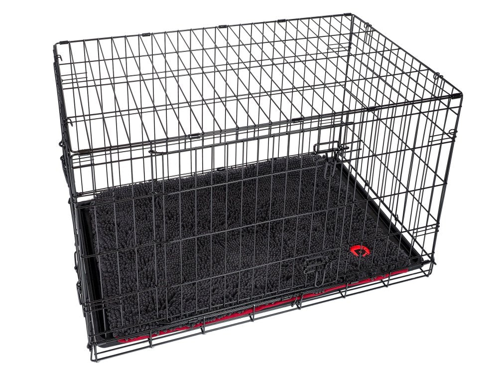 Black wire pet crate with a grey mat inside on a white background
