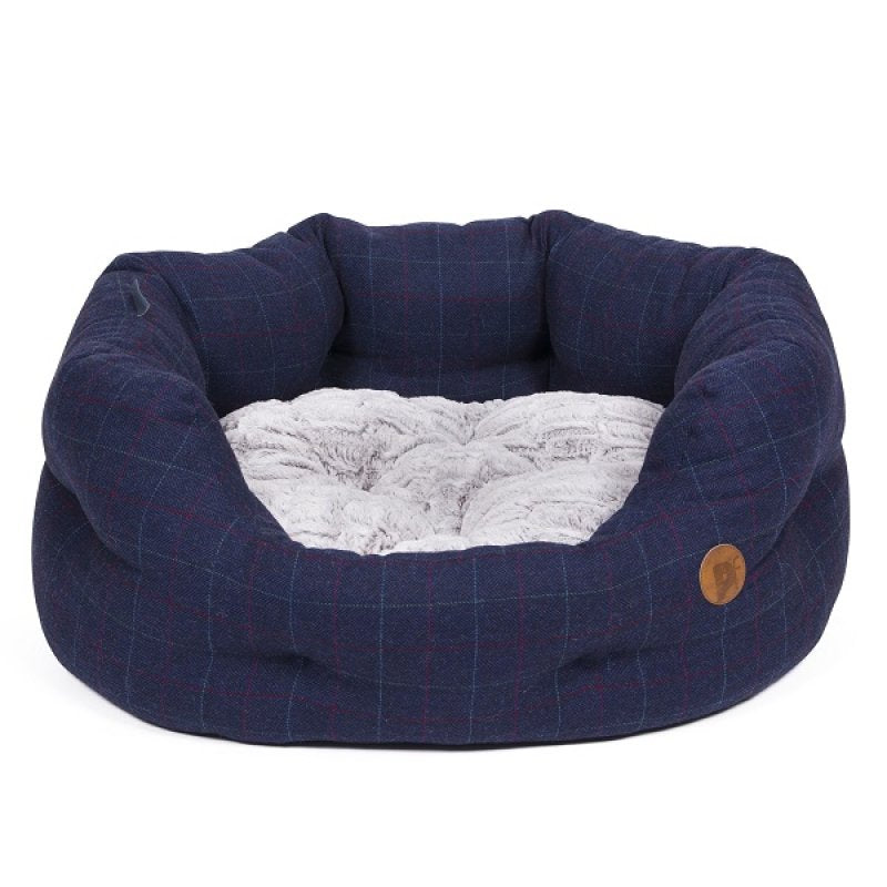 Navy blue pet bed with a textured interior on a white background