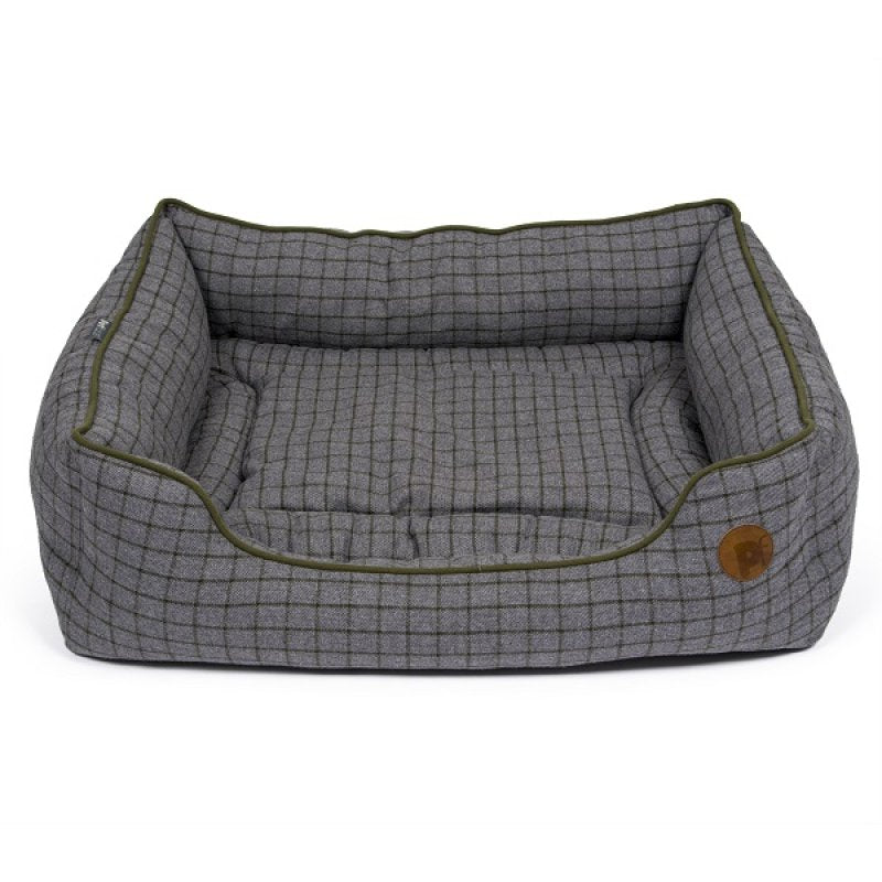 Gray checkered pet bed with green trim on a white background