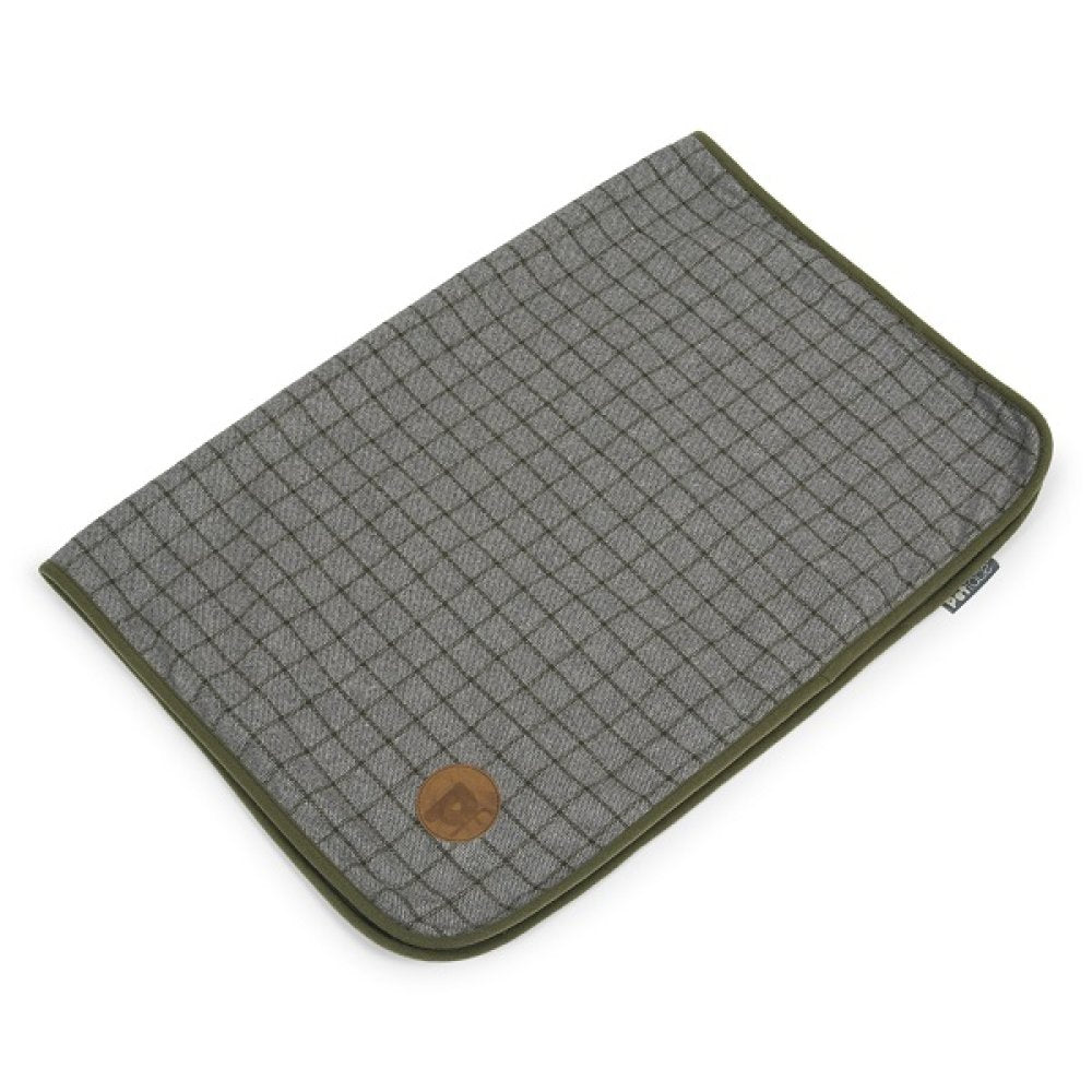 Grid-patterned blanket with a brown circular logo on a white background
