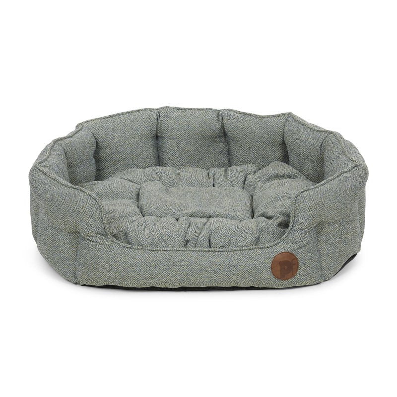 Gray pet bed with a wooden button on a white background
