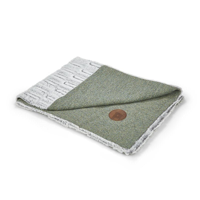Folded sage herringbone pet comforter on a white background