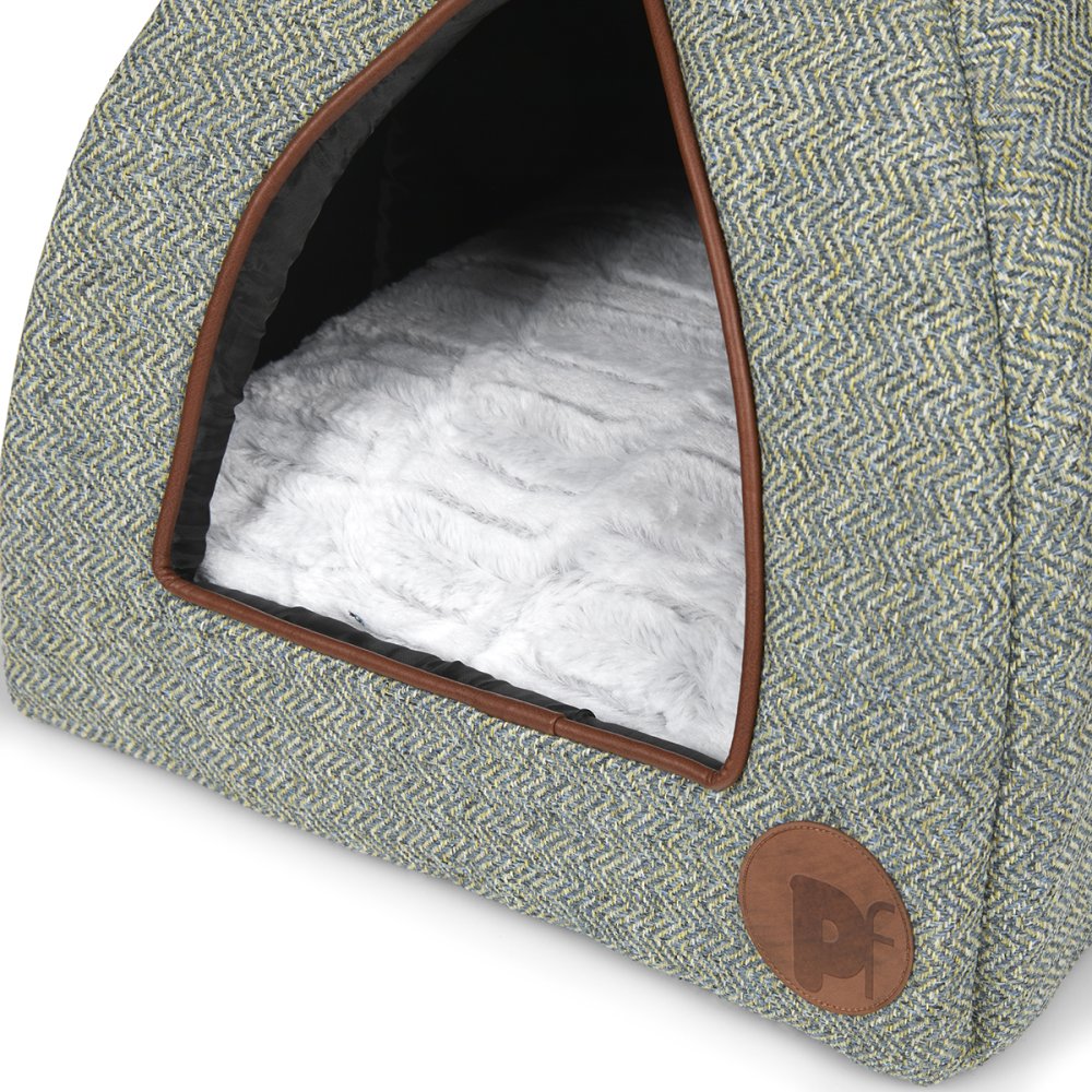 Pet bed with a textured green exterior and white interior