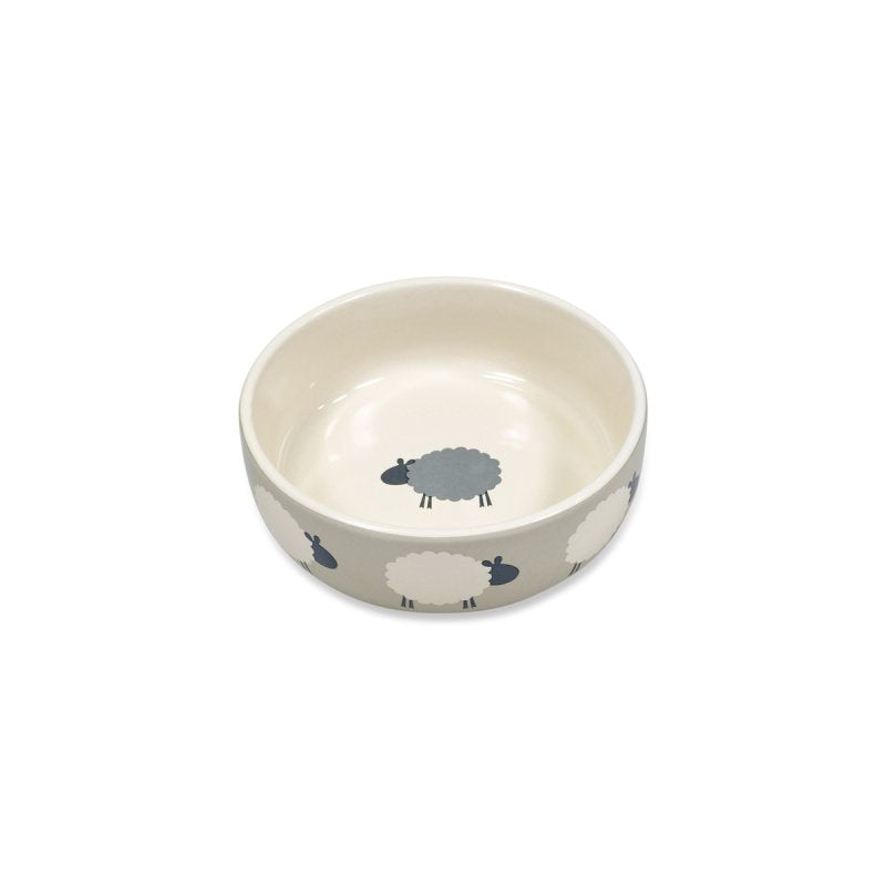 Ceramic bowl with sheep design on a white background