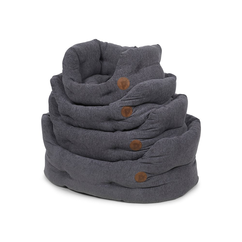 Gray fabric pet beds with brown buttons on a white background