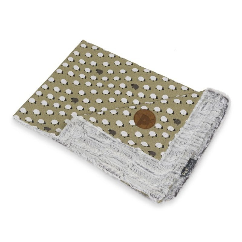 Blanket with sheep pattern and brown circle on a white background