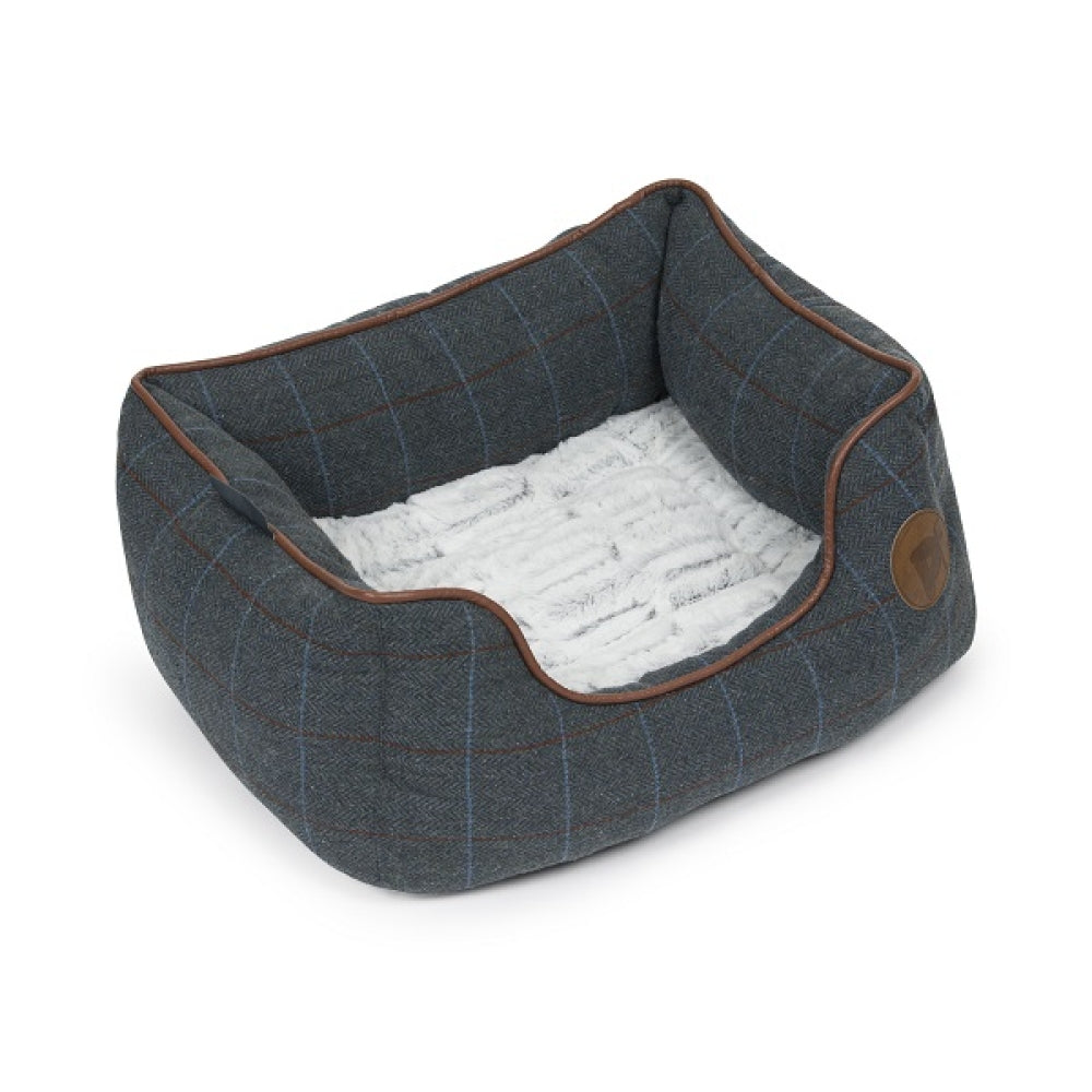 Dog bed with plaid pattern and white interior on a white background