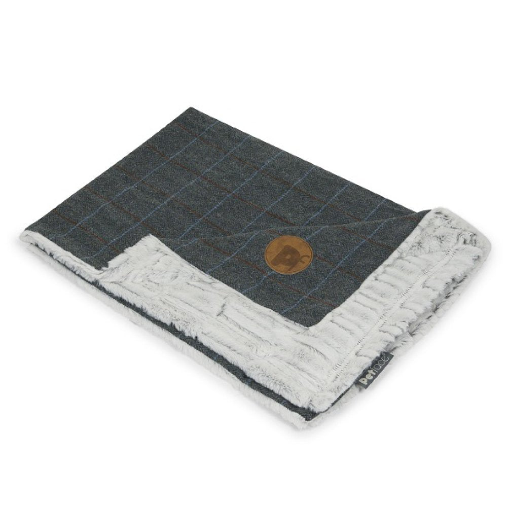 Folded blanket with checkered pattern on one side and textured reverse side on a white background
