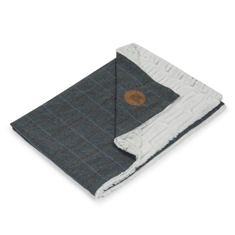 Plaid blanket with a brown circle logo on a white background
