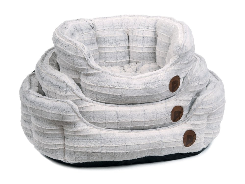 Textured pet beds with wooden buttons on a white background