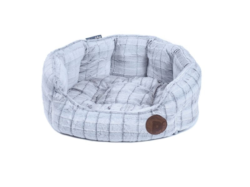 Plush pet bed with a checkered pattern on a white background