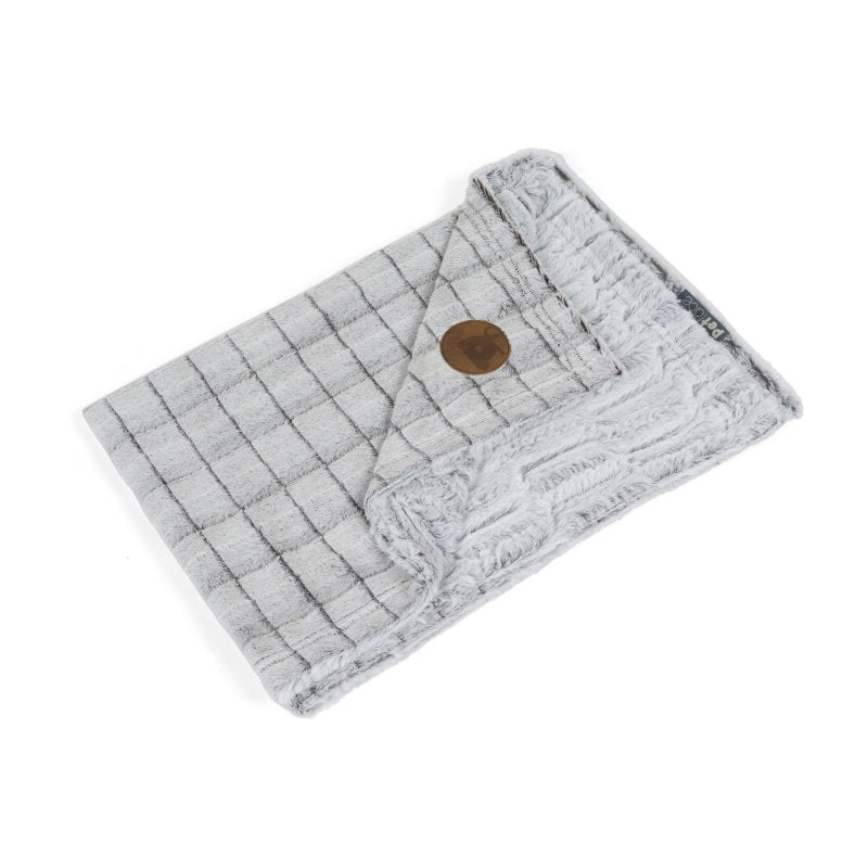 White plush pet comforter with a soft check pattern