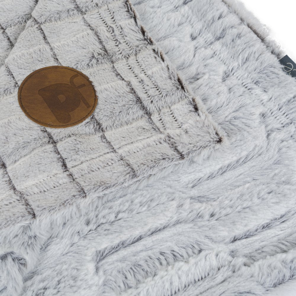 Close-up of a textured gray fabric with a coin for scale